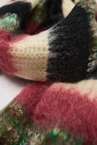 Mixed black, cream, pink and green stripe textured knit oversized blanket scarf, worn by model.