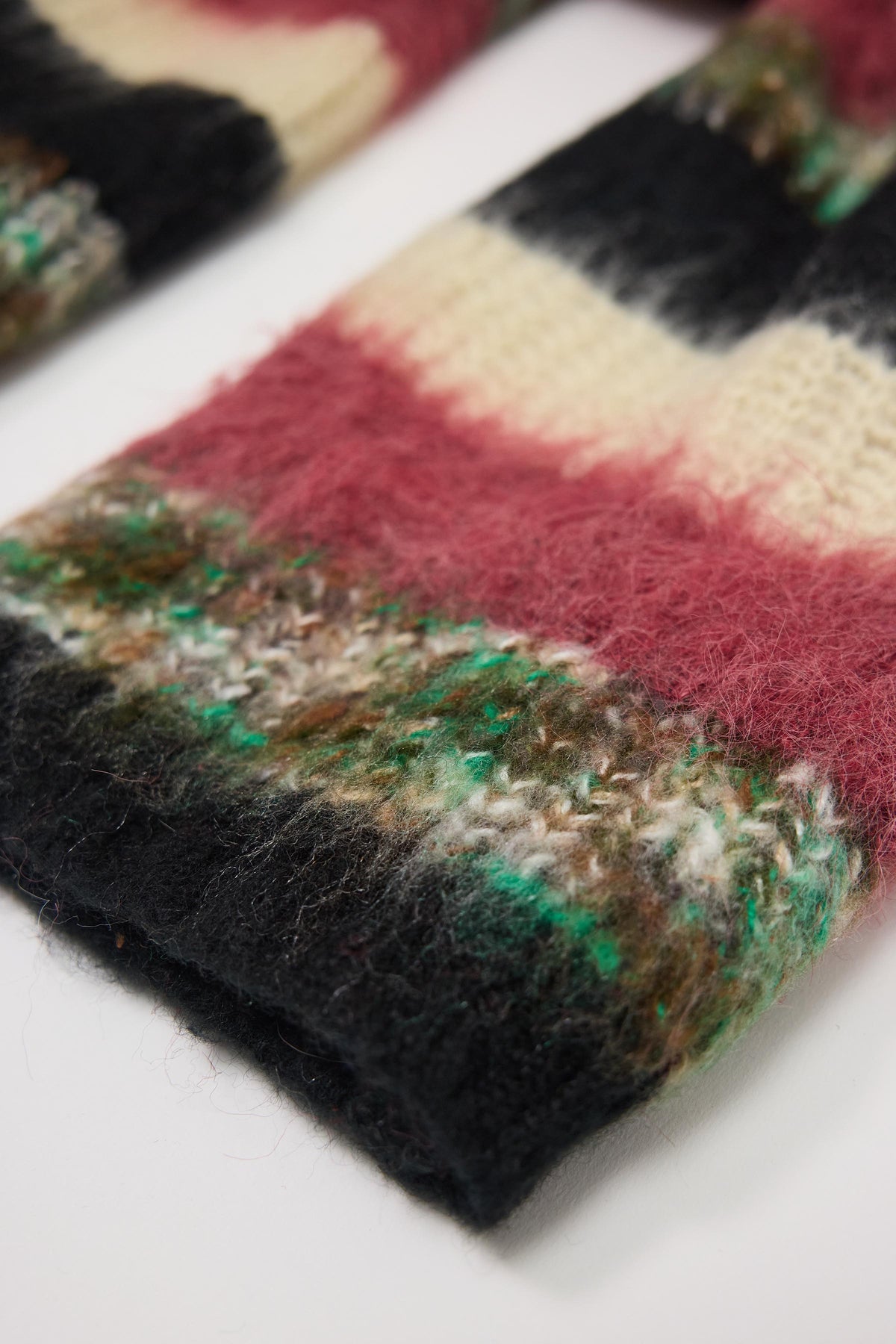 Mixed black, cream, pink and green stripe textured knit oversized blanket scarf, worn by model.