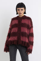 Bugundy and dusty stripe fuzzy knit cardigan with peplum hem, worn by model