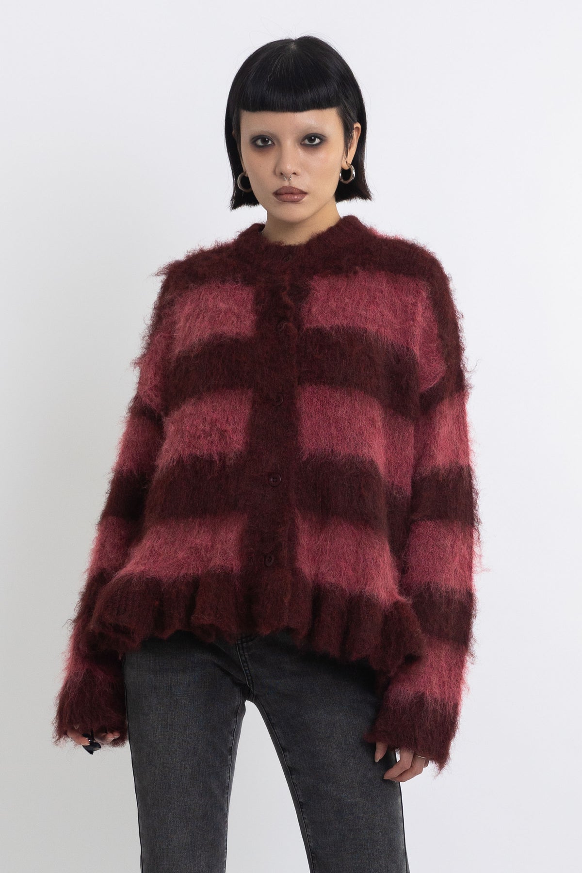 Bugundy and dusty stripe fuzzy knit cardigan with peplum hem, worn by model