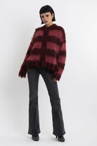Bugundy and dusty stripe fuzzy knit cardigan with peplum hem, worn by model