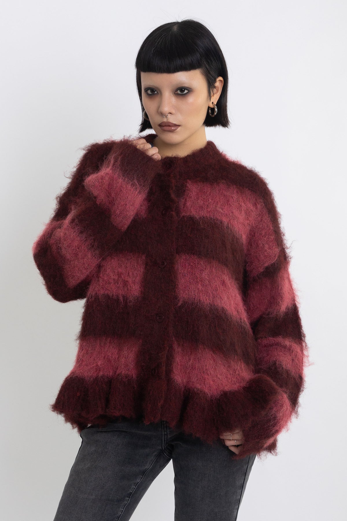 Bugundy and dusty stripe fuzzy knit cardigan with peplum hem, worn by model