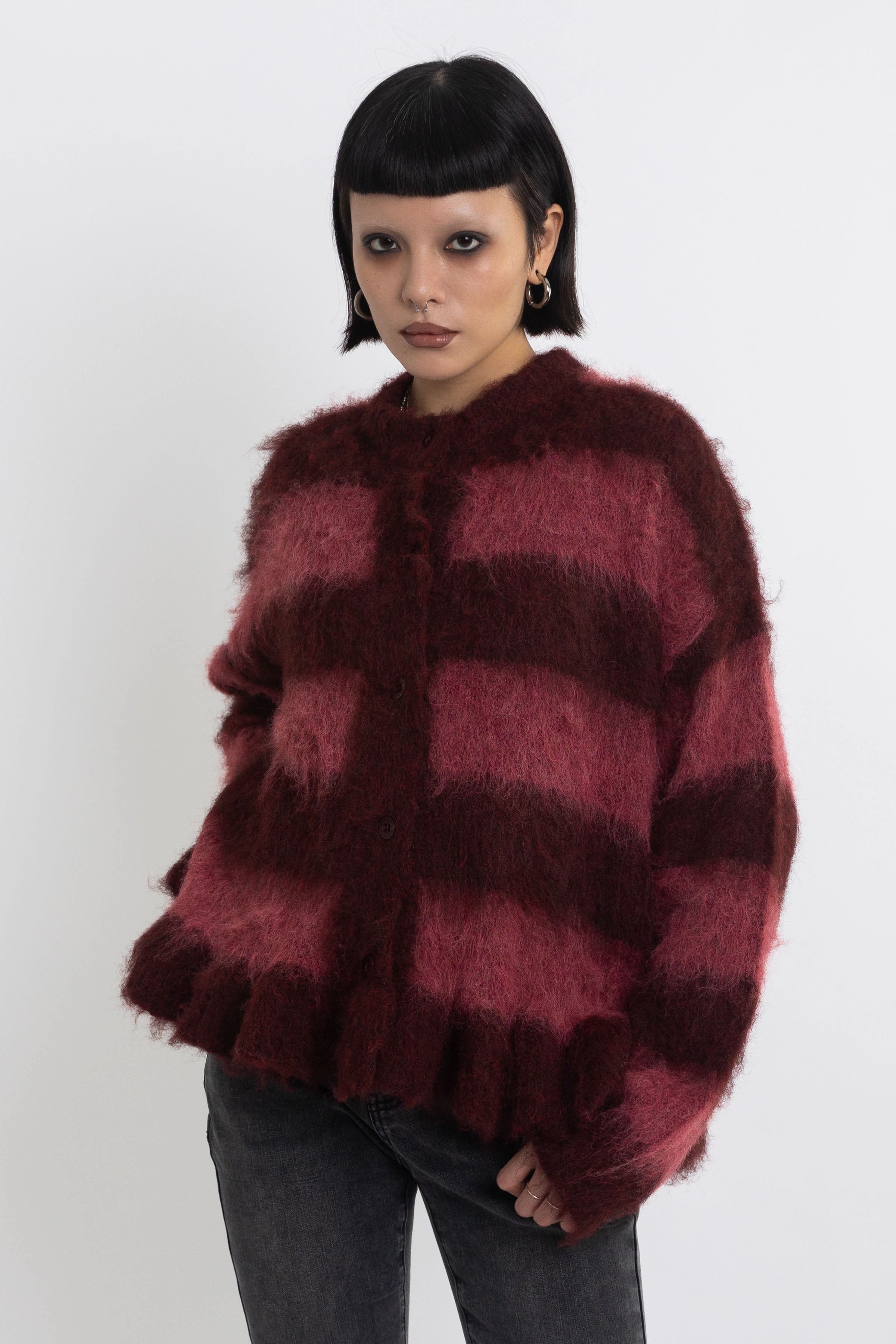 Bugundy and dusty stripe fuzzy knit cardigan with peplum hem, worn by model