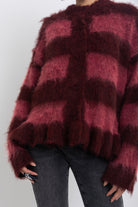 Bugundy and dusty stripe fuzzy knit cardigan with peplum hem, worn by model