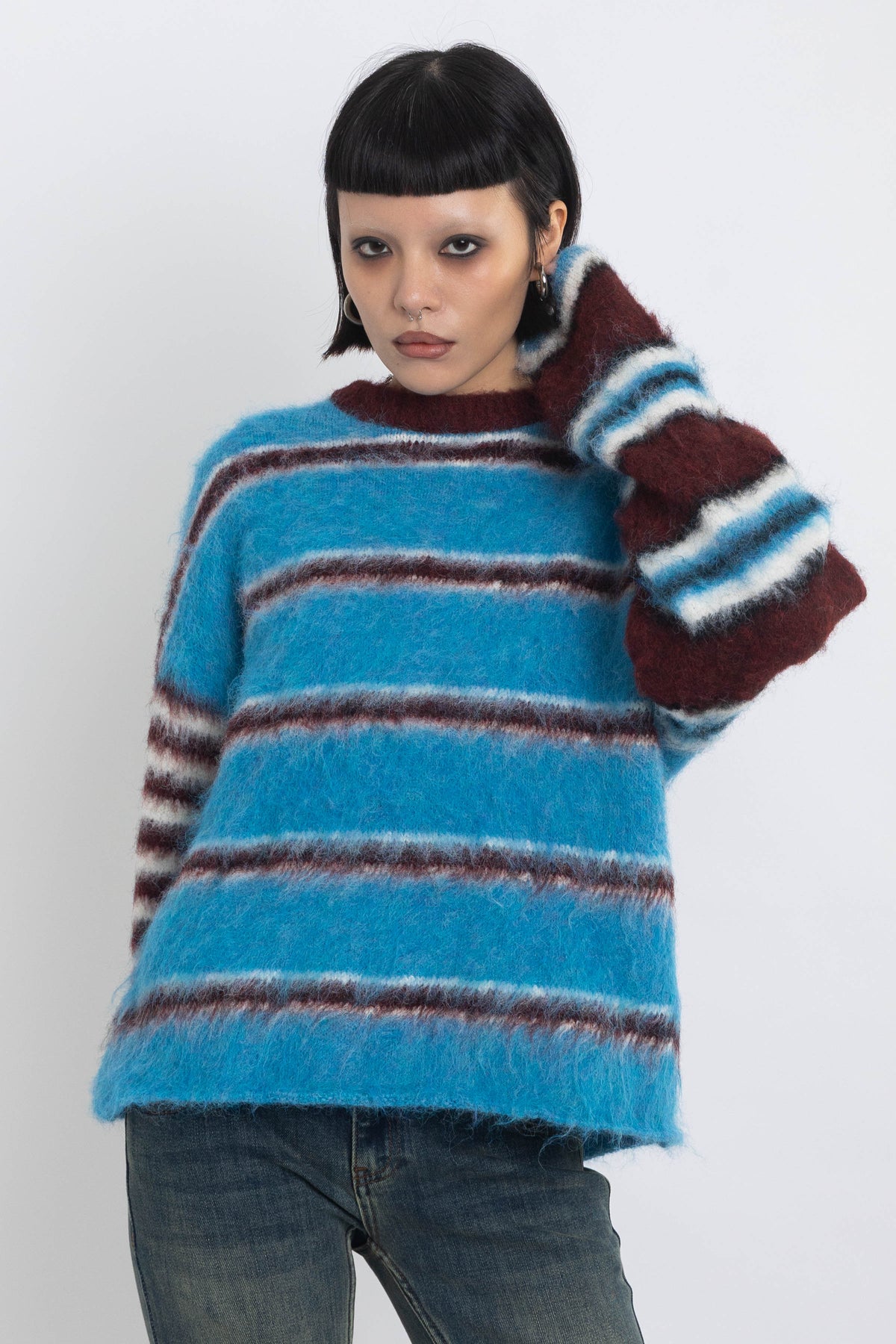 Blue and burgundy stripe fuzzy knit jumper, worn by model