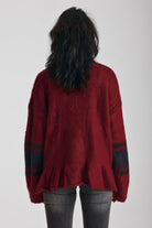 Red oversized v-neck knit jumper with varsity stripe detail and peplum hem, worn by model