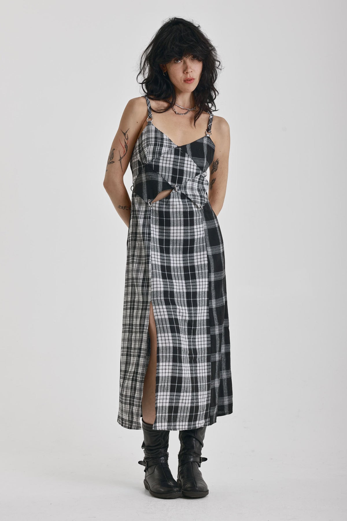 Black and white mixed check midi dress with cut-out panels and thigh split, worn by model