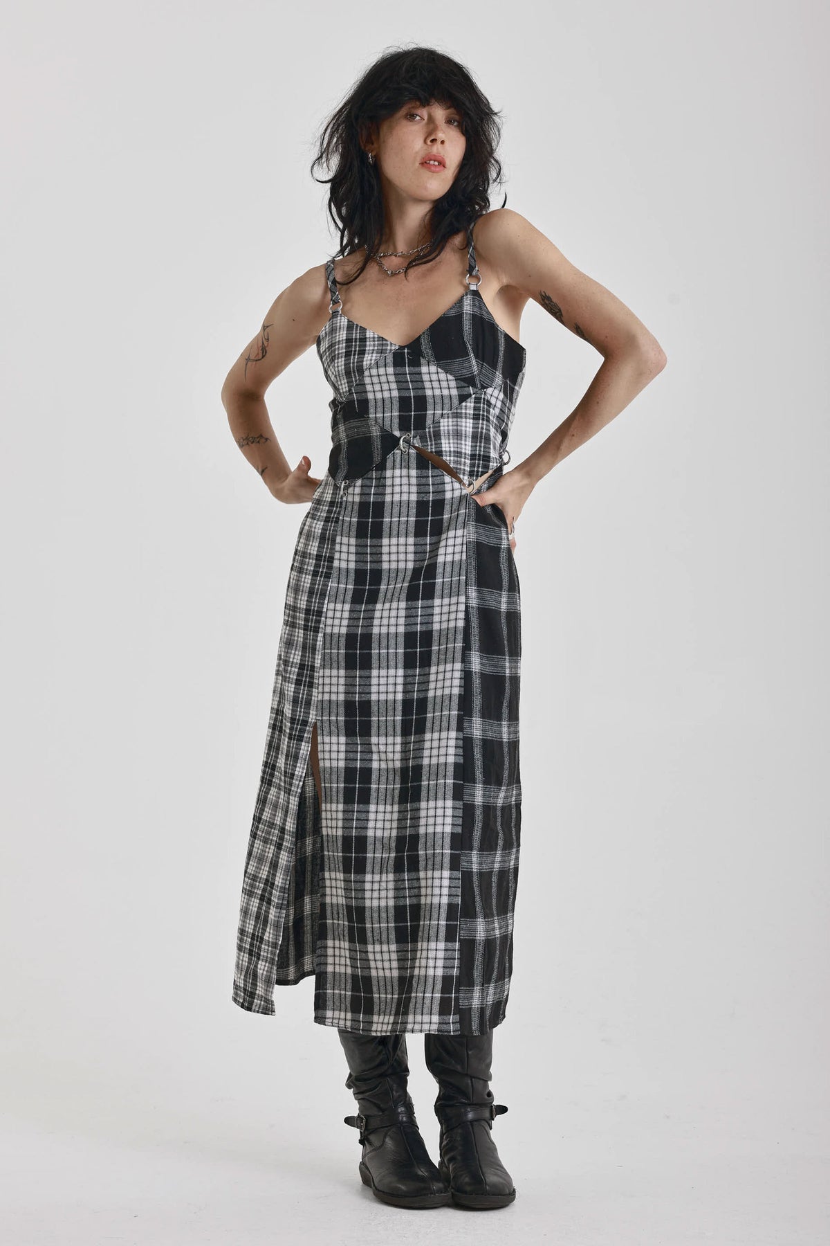 Black and white mixed check midi dress with cut-out panels and thigh split, worn by model