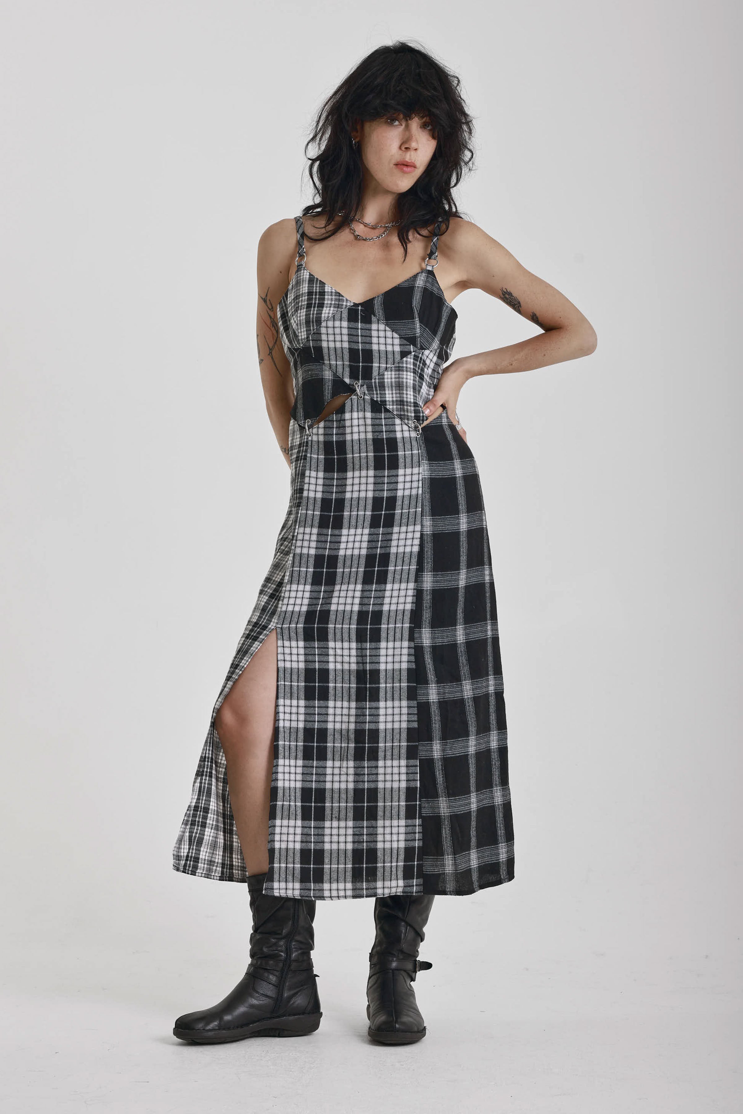 Black and white mixed check midi dress with cut-out panels and thigh split, worn by model