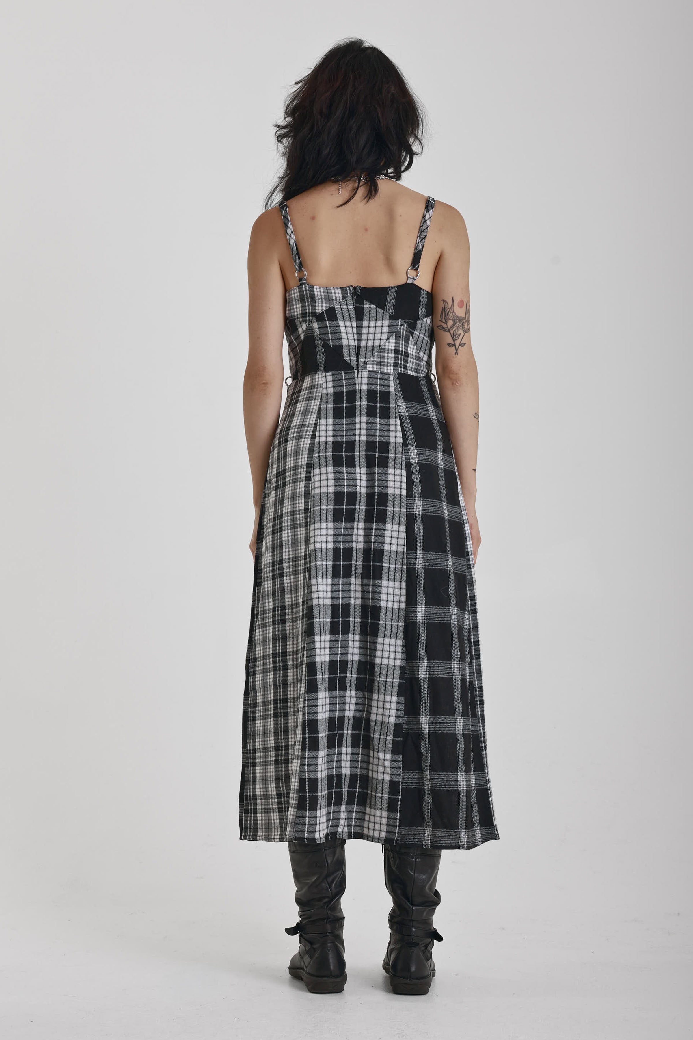 Black and white mixed check midi dress with cut-out panels and thigh split, worn by model
