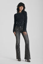 Washed black flare jeans with zip detail, worn by model