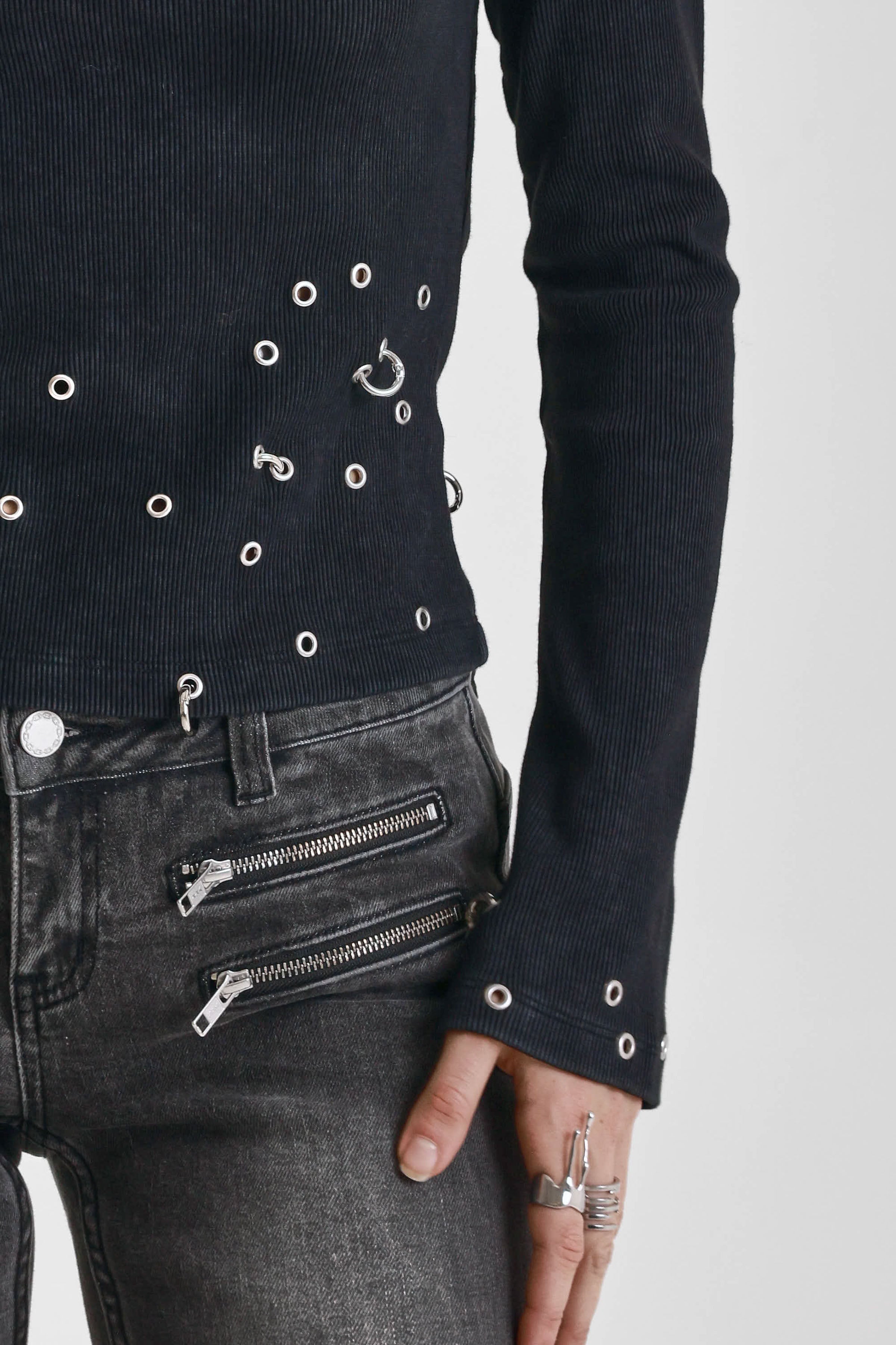 Washed black flare jeans with zip detail, worn by model