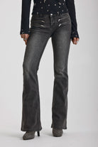 Washed black flare jeans with zip detail, worn by model