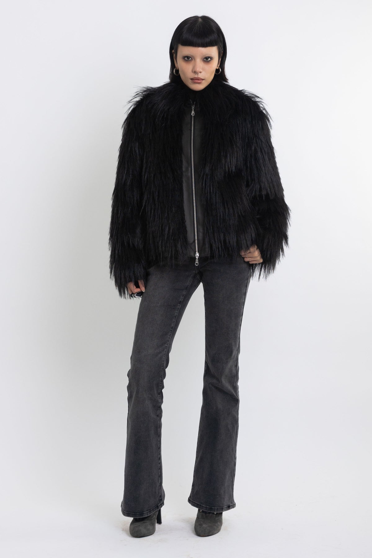 Black shaggy faux fur jacket with pu faux leather panel, worn by model