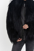 Black shaggy faux fur jacket with pu faux leather panel, worn by model