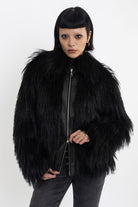 Black shaggy faux fur jacket with pu faux leather panel, worn by model