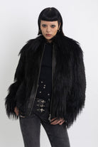 Black shaggy faux fur jacket with pu faux leather panel, worn by model