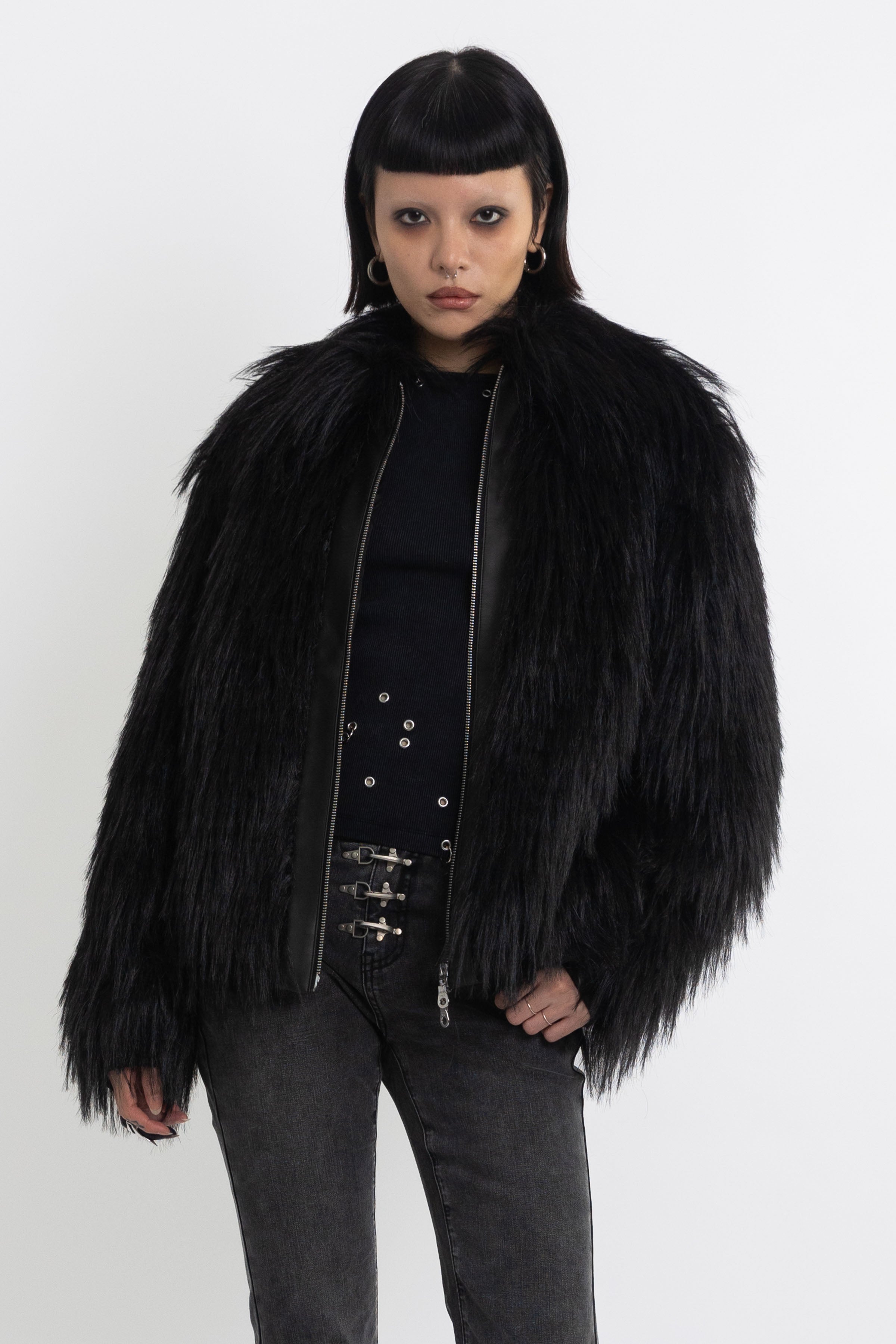 Black shaggy faux fur jacket with pu faux leather panel, worn by model