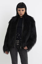 Black shaggy faux fur jacket with pu faux leather panel, worn by model