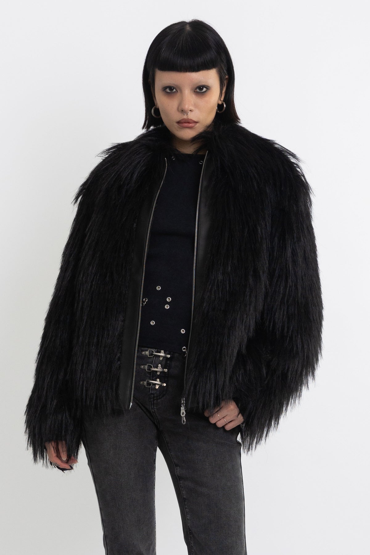 Black shaggy faux fur jacket with pu faux leather panel, worn by model
