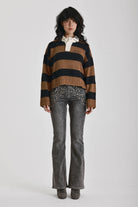 Black and brown stripe rugby polo knit jumper with varsity back print, worn by model
