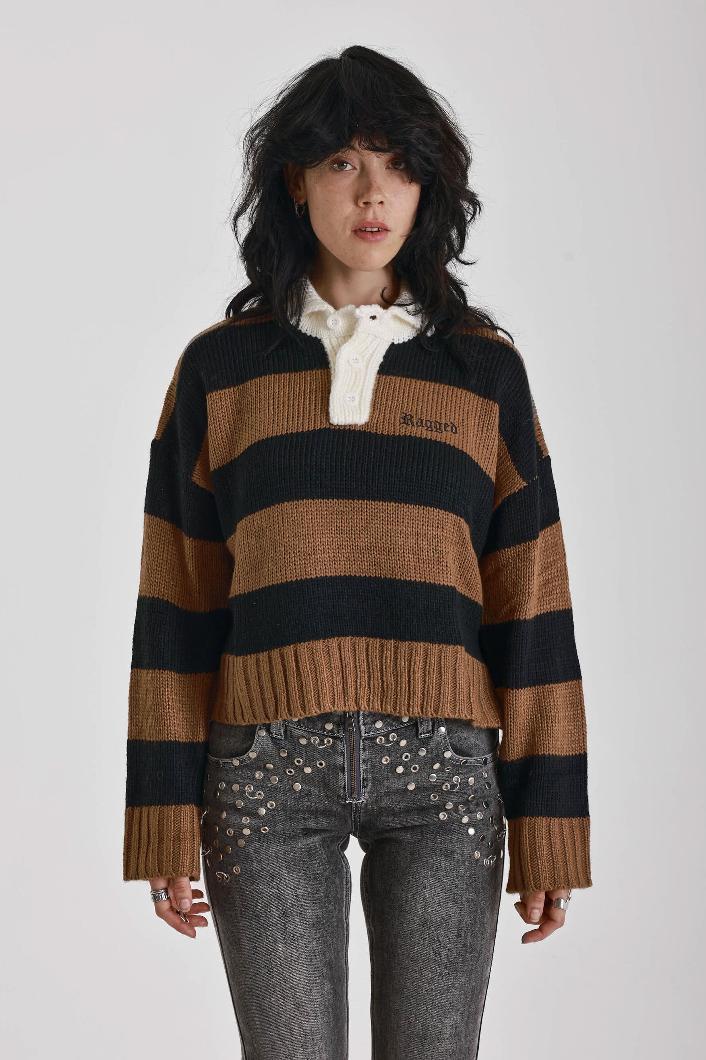 Black and brown stripe rugby polo knit jumper with varsity back print, worn by model