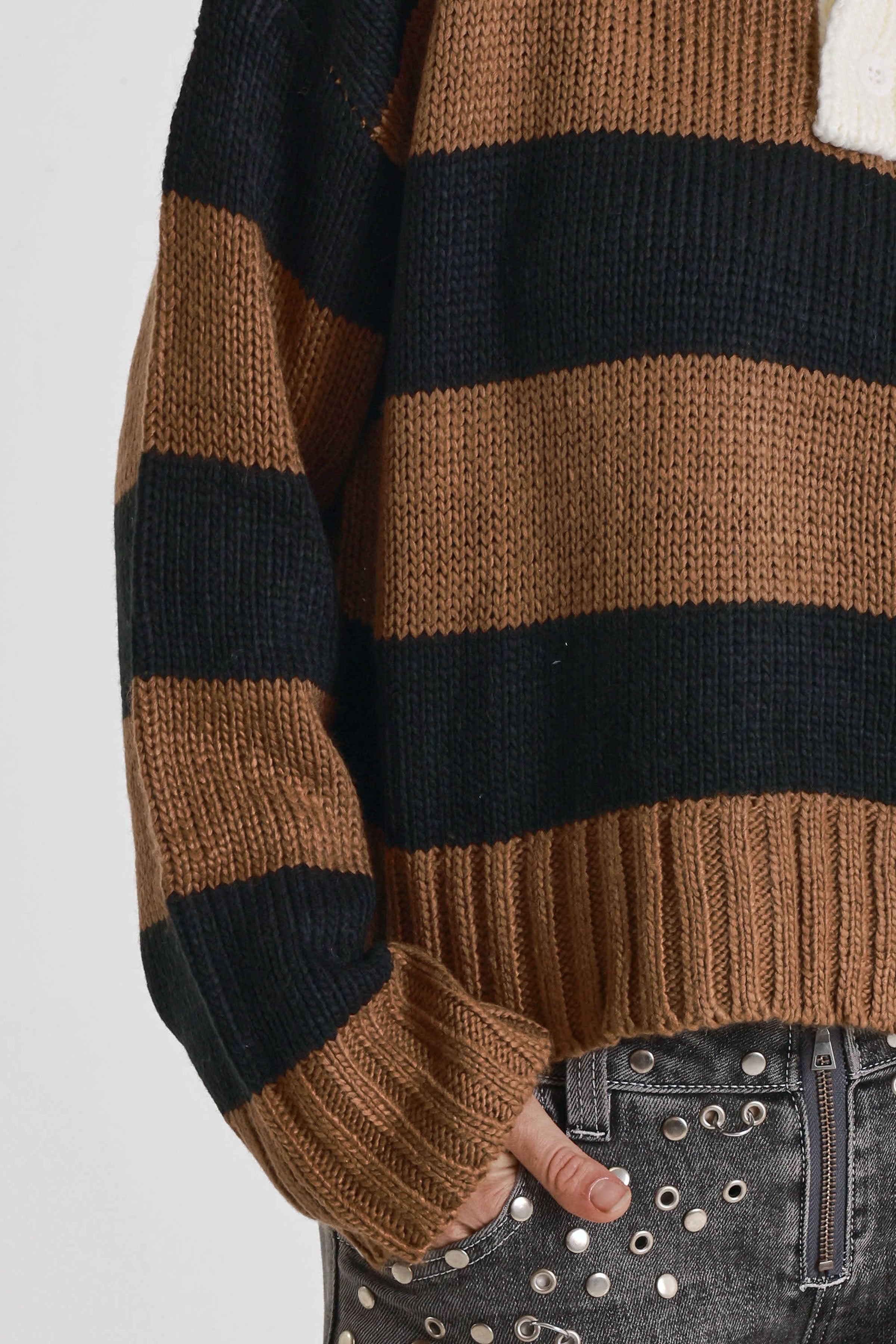 Black and brown stripe rugby polo knit jumper with varsity back print, worn by model