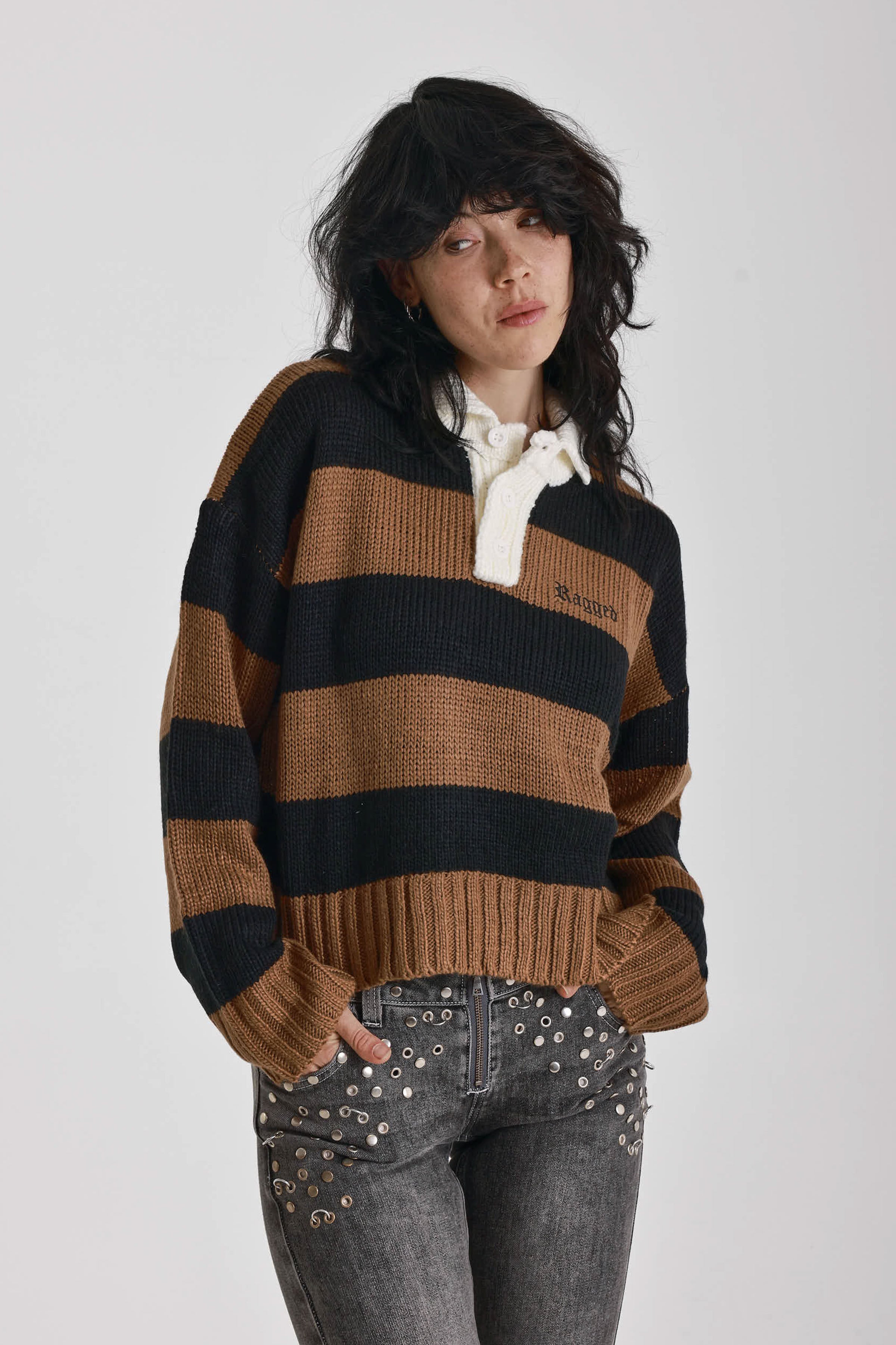 Black and brown stripe rugby polo knit jumper with varsity back print, worn by model