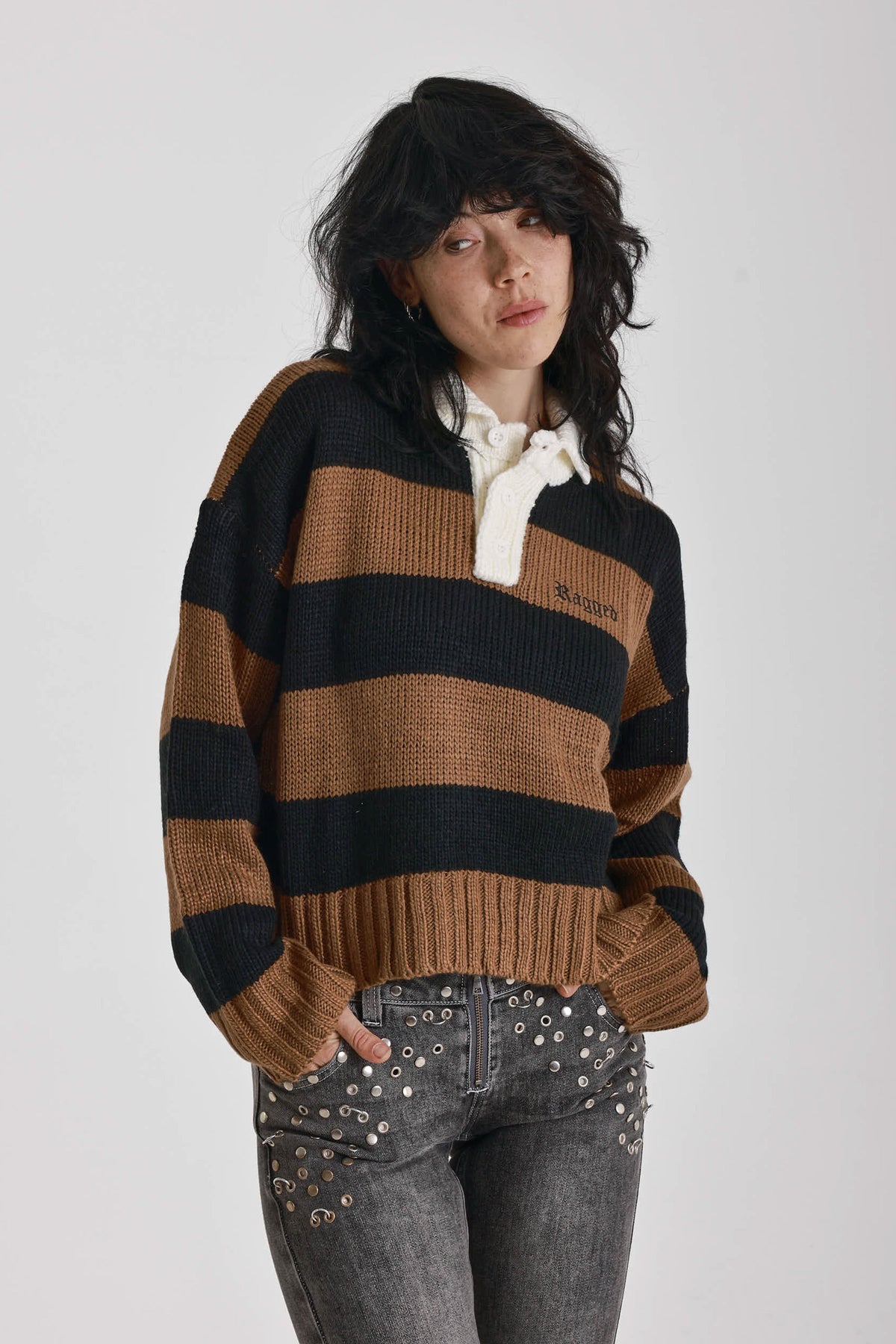Black and brown stripe rugby polo knit jumper with varsity back print, worn by model