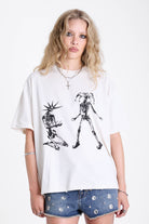 White oversized t-shirt with skeleton jester graphic print, worn by model