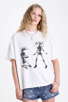 White oversized t-shirt with skeleton jester graphic print, worn by model