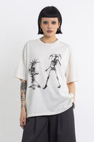 Vintage wash oversized graphic t-shirt with skeleton print, worn by model