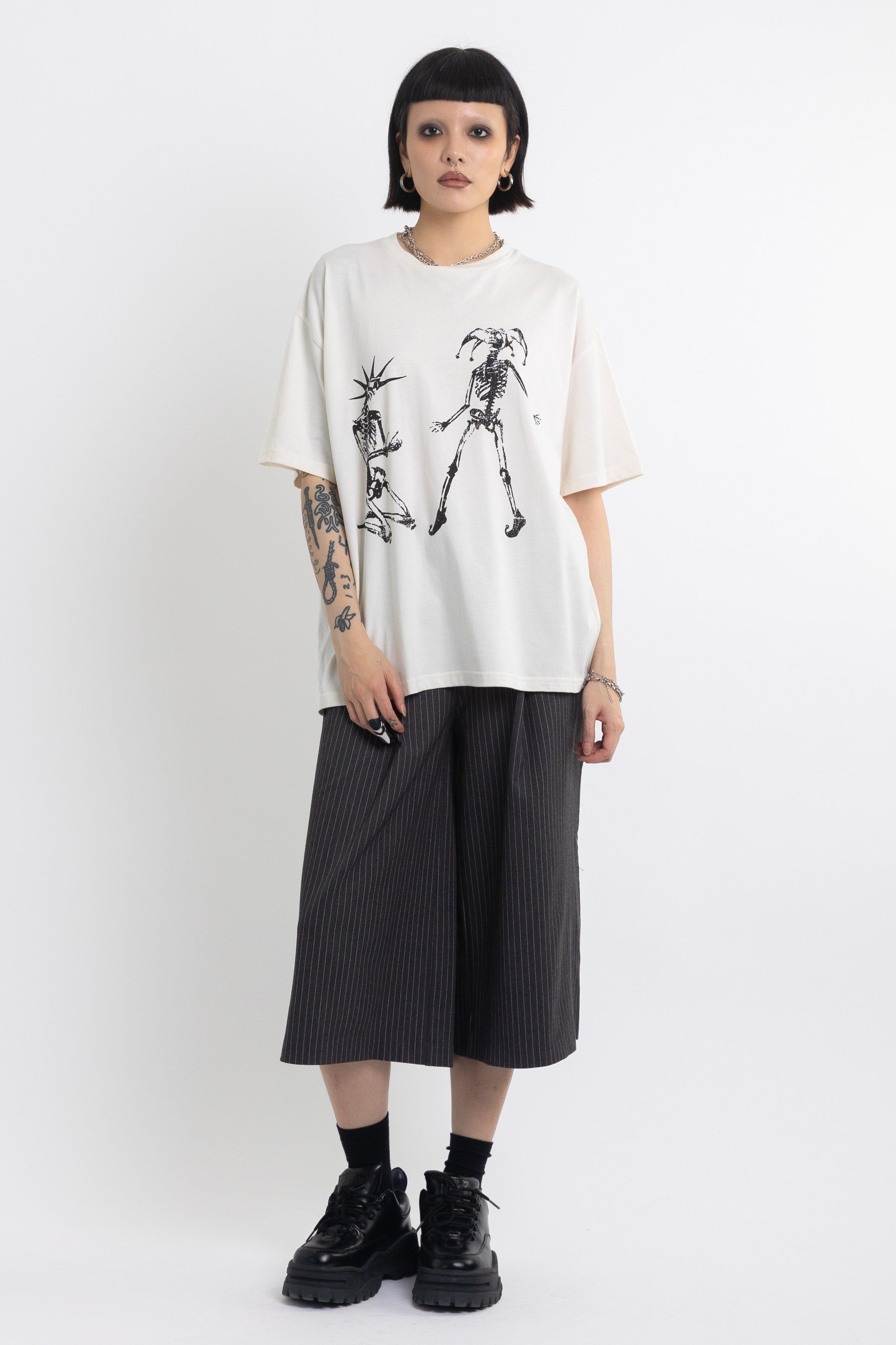 Vintage wash oversized graphic t-shirt with skeleton print, worn by model