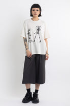Vintage wash oversized graphic t-shirt with skeleton print, worn by model