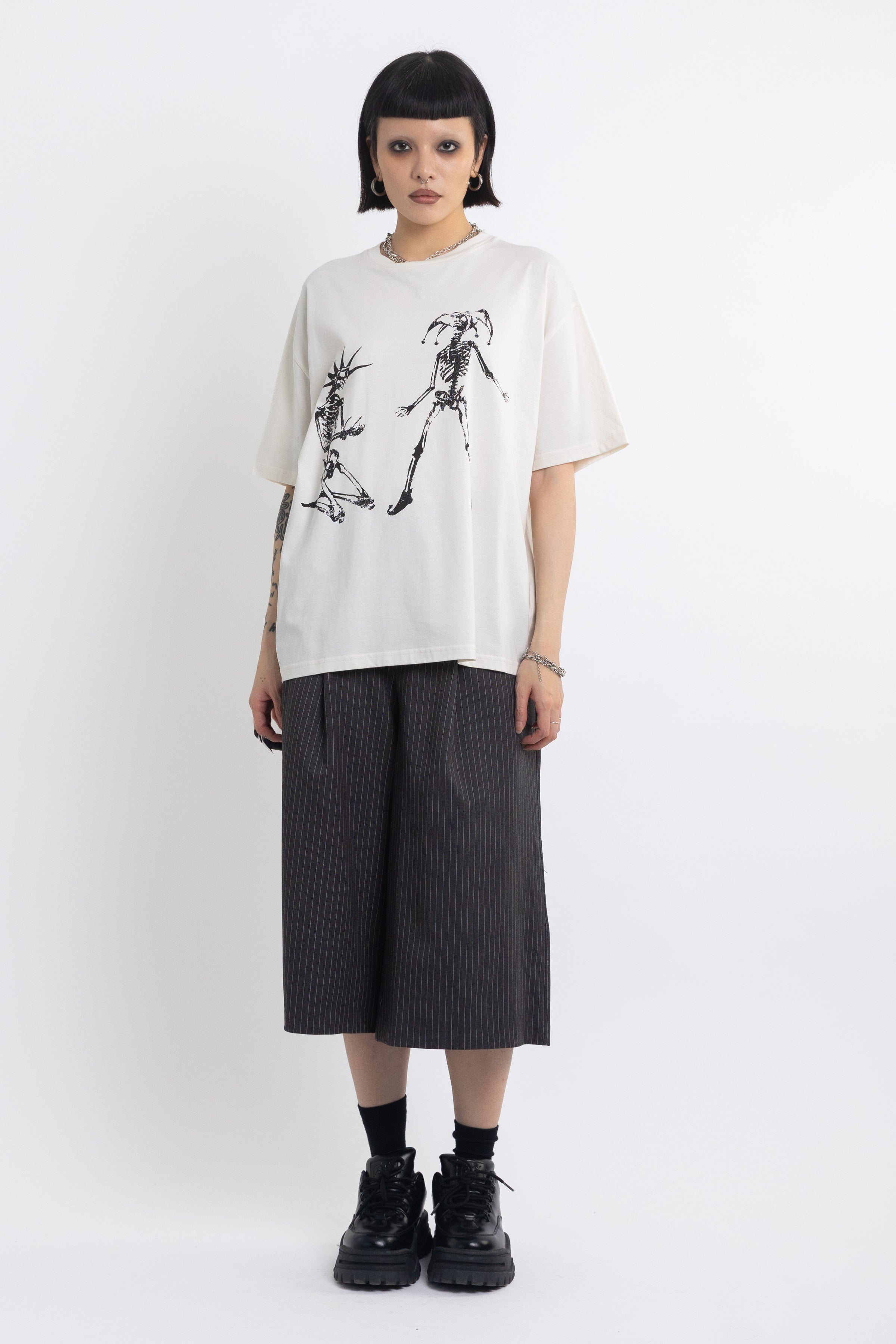 Vintage wash oversized graphic t-shirt with skeleton print, worn by model