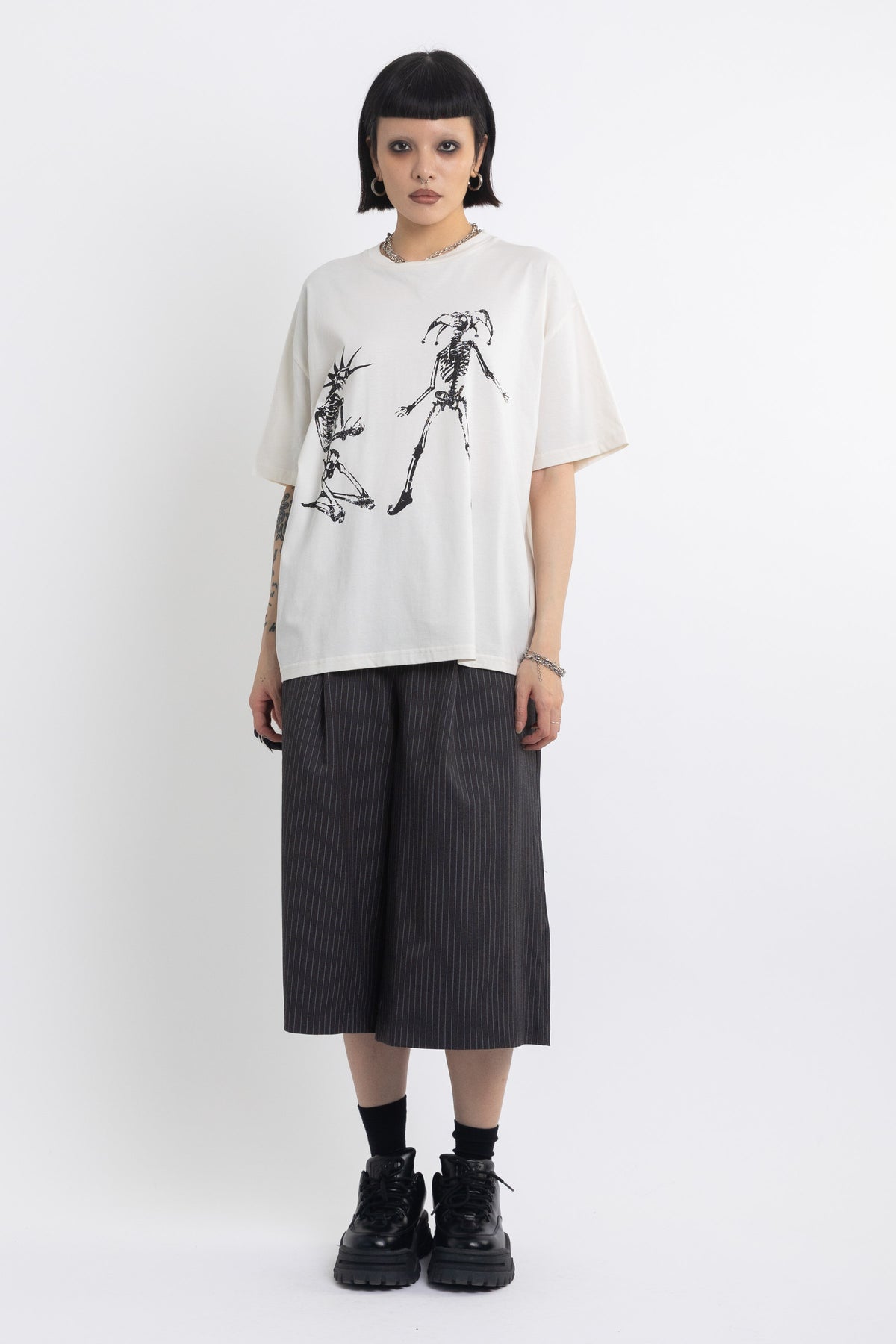 Vintage wash oversized graphic t-shirt with skeleton print, worn by model