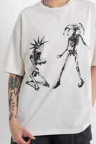 Vintage wash oversized graphic t-shirt with skeleton print, worn by model
