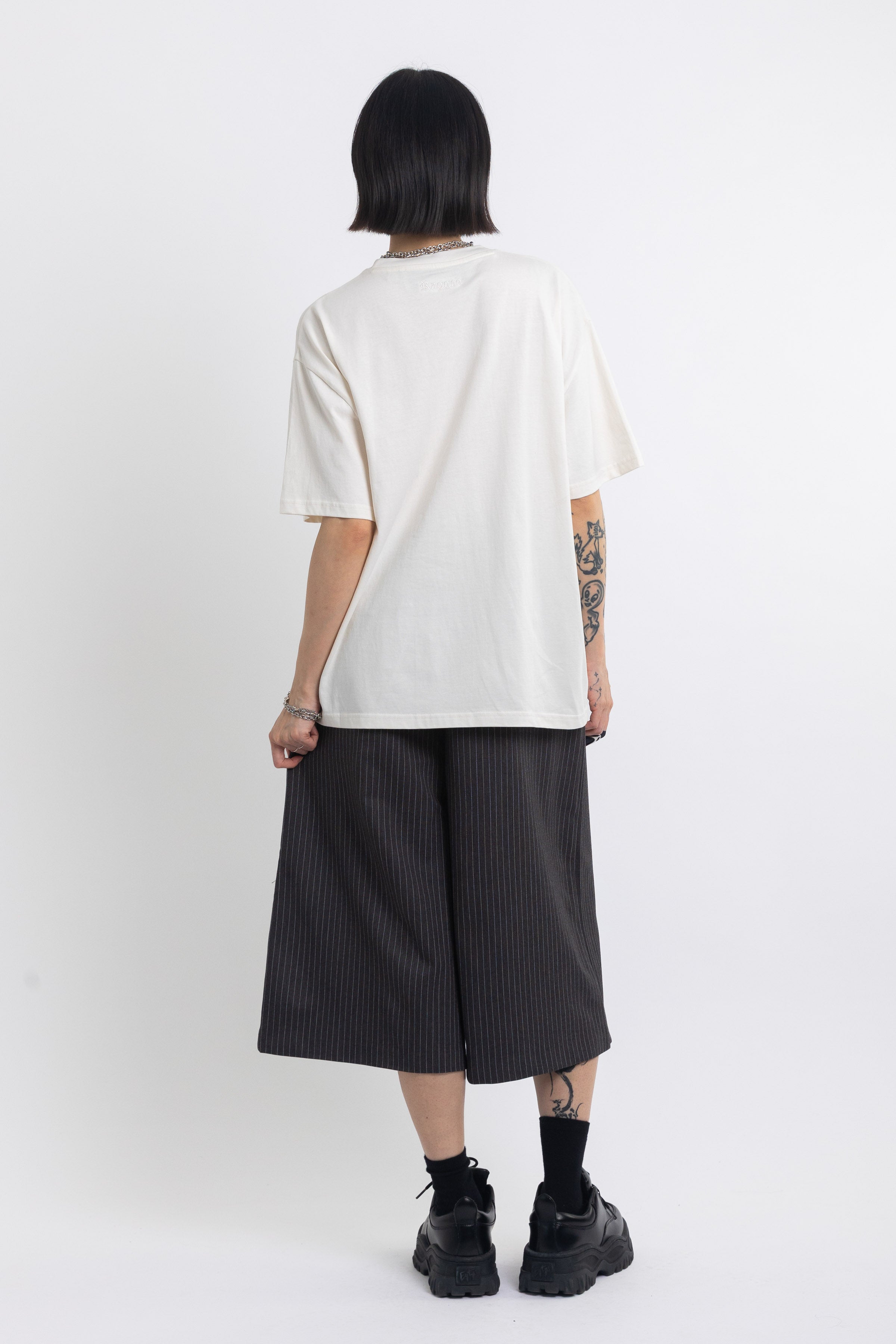 Vintage wash oversized graphic t-shirt with skeleton print, worn by model