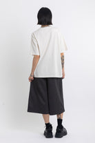 Vintage wash oversized graphic t-shirt with skeleton print, worn by model