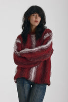 Red and white vertical stripe oversized knit jumper in fluffy brushed yarn, worn by model