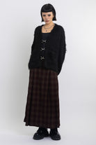 Black fluffy longline v-neck cardigan with oversized silver horsebit hardware clasps, worn by model