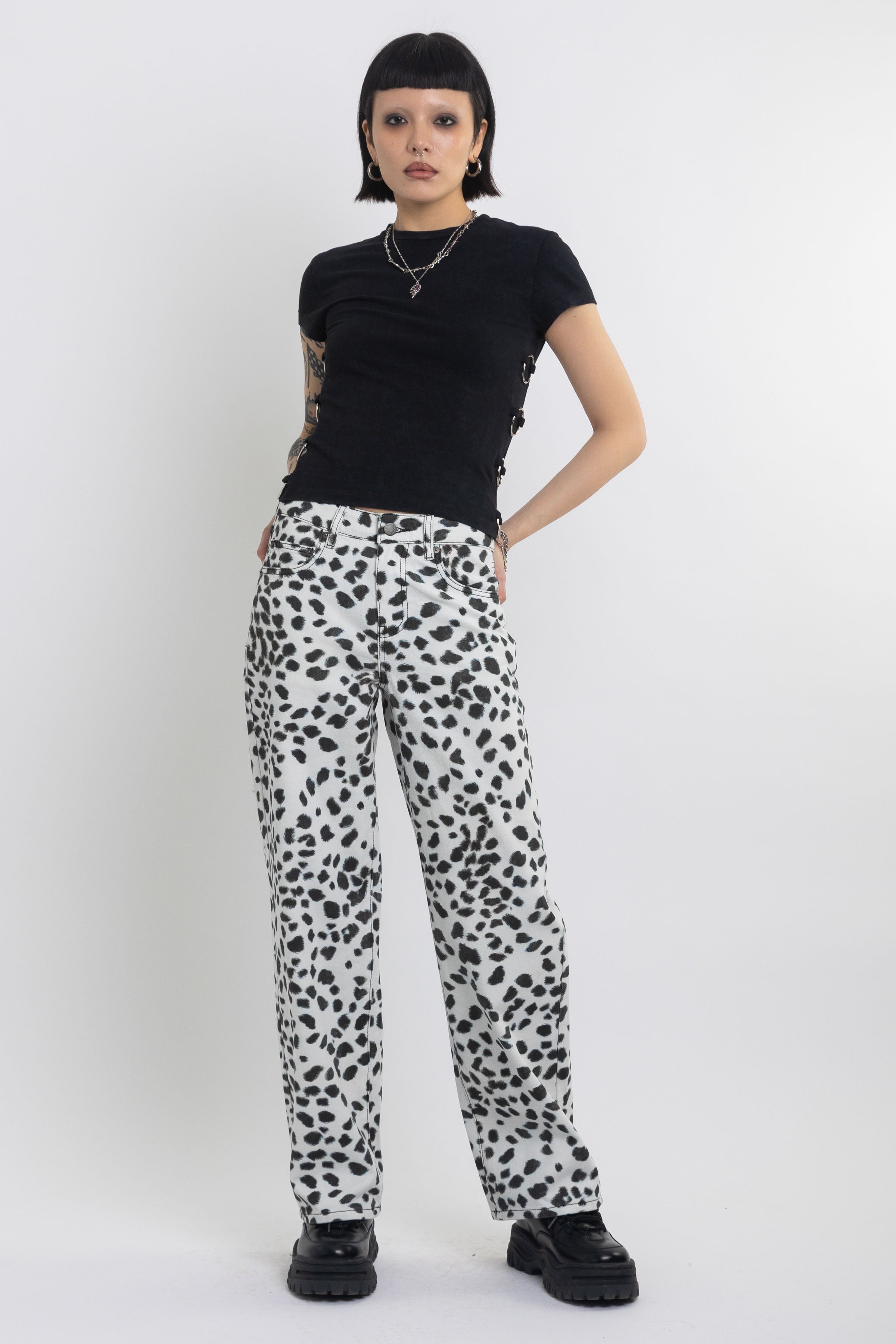 Black and white dalamatian spot print relaxed leg jeans, worn by model