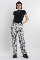 Black and white dalamatian spot print relaxed leg jeans, worn by model