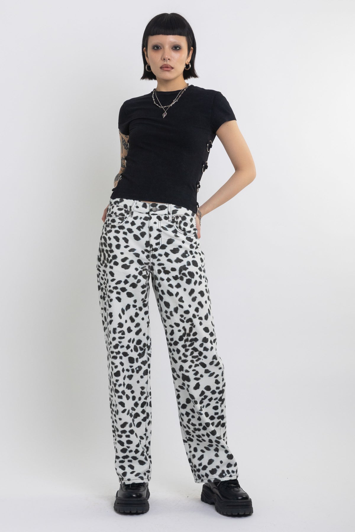 Black and white dalamatian spot print relaxed leg jeans, worn by model