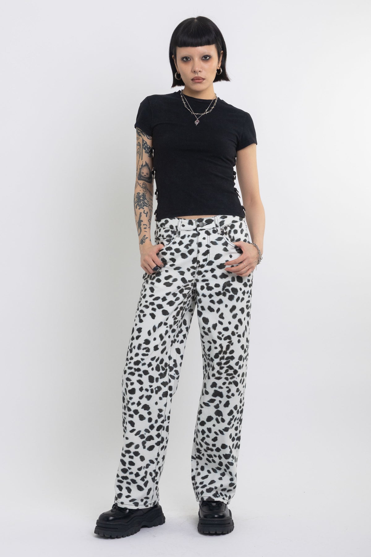 Black and white dalamatian spot print relaxed leg jeans, worn by model