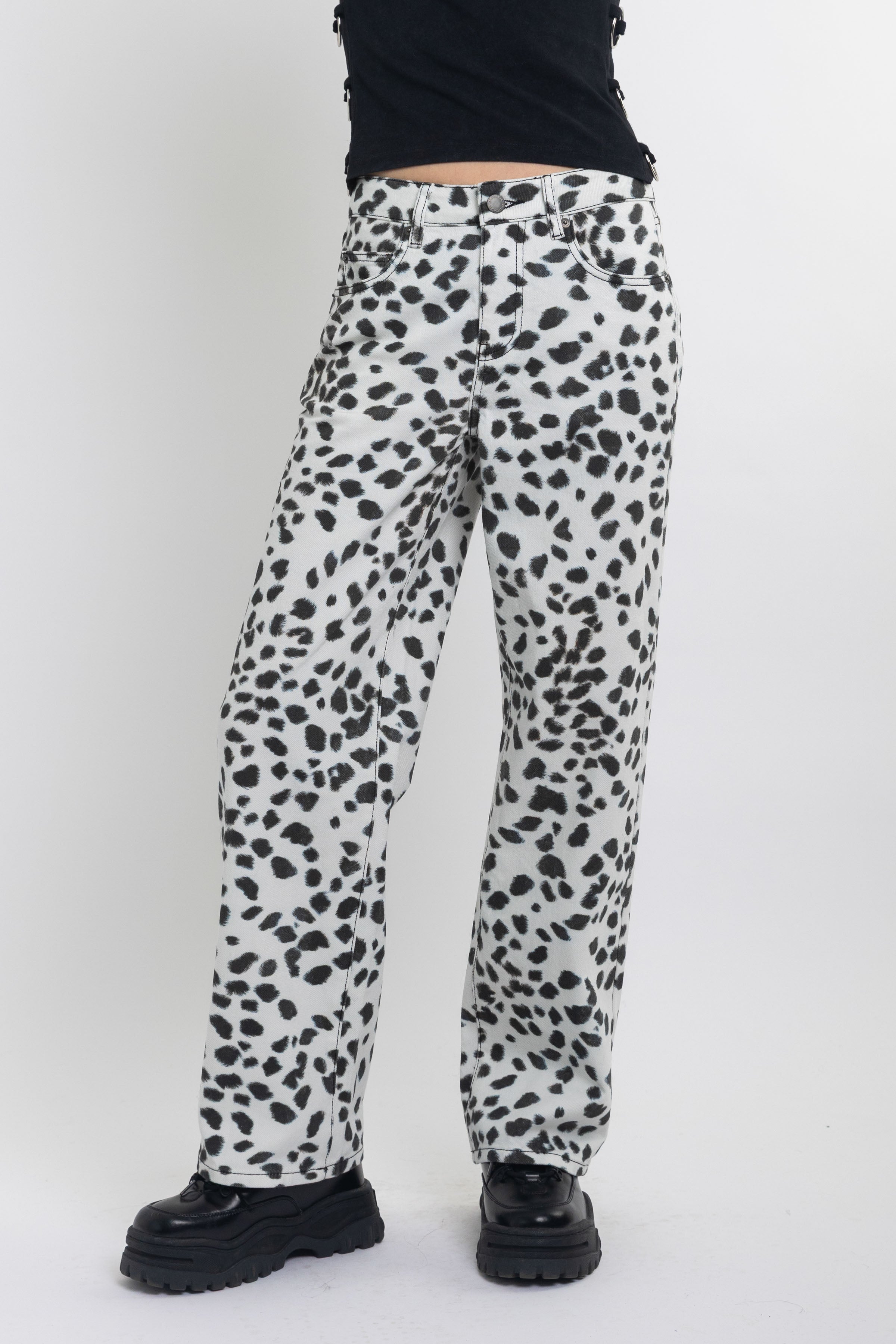 Black and white dalamatian spot print relaxed leg jeans, worn by model