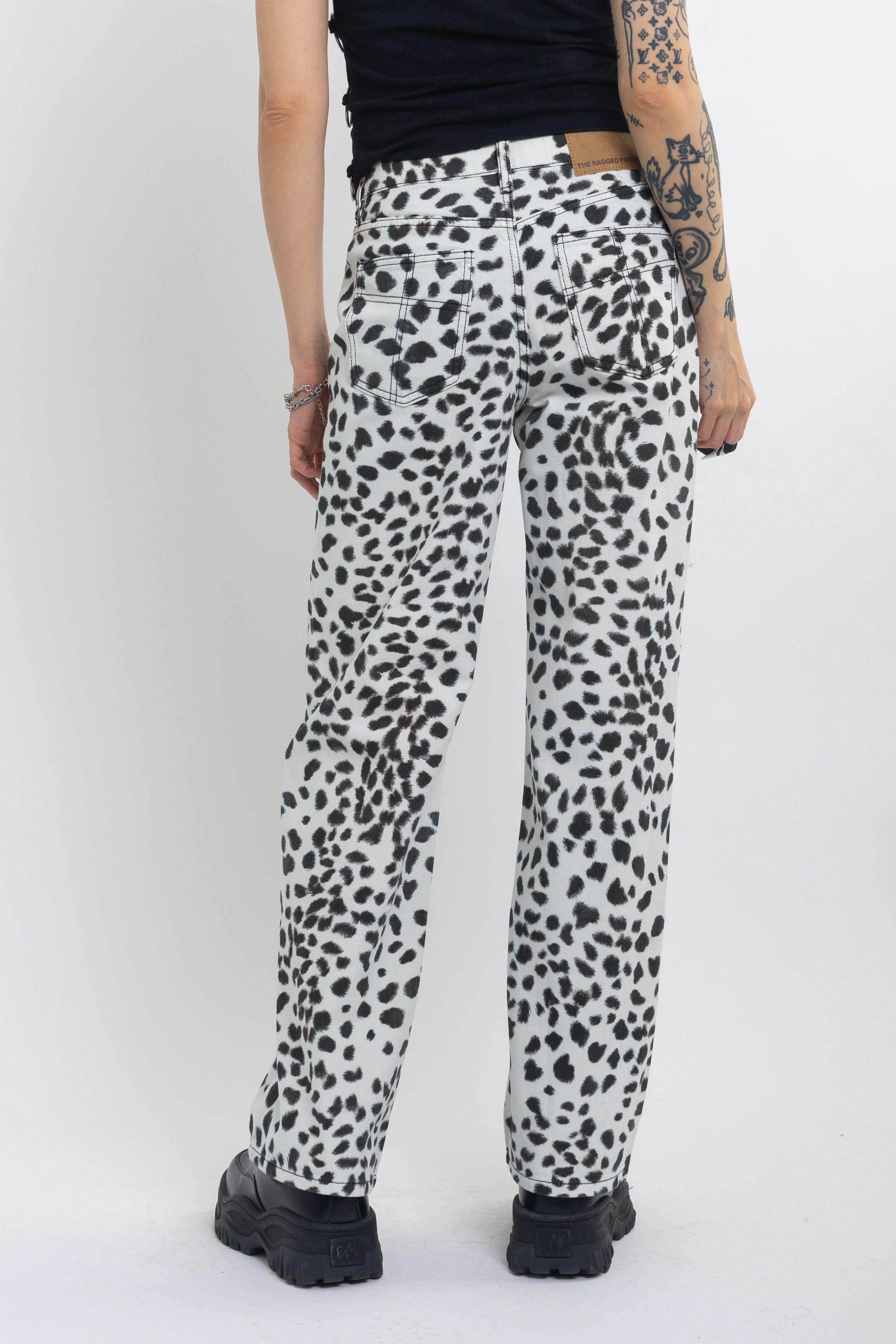 Black and white dalamatian spot print relaxed leg jeans, worn by model