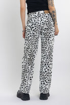 Black and white dalamatian spot print relaxed leg jeans, worn by model