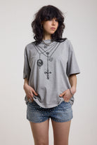 Grey marl oversized baby t-shirt with rosary pendants and cross necklace graphic, worn by a model