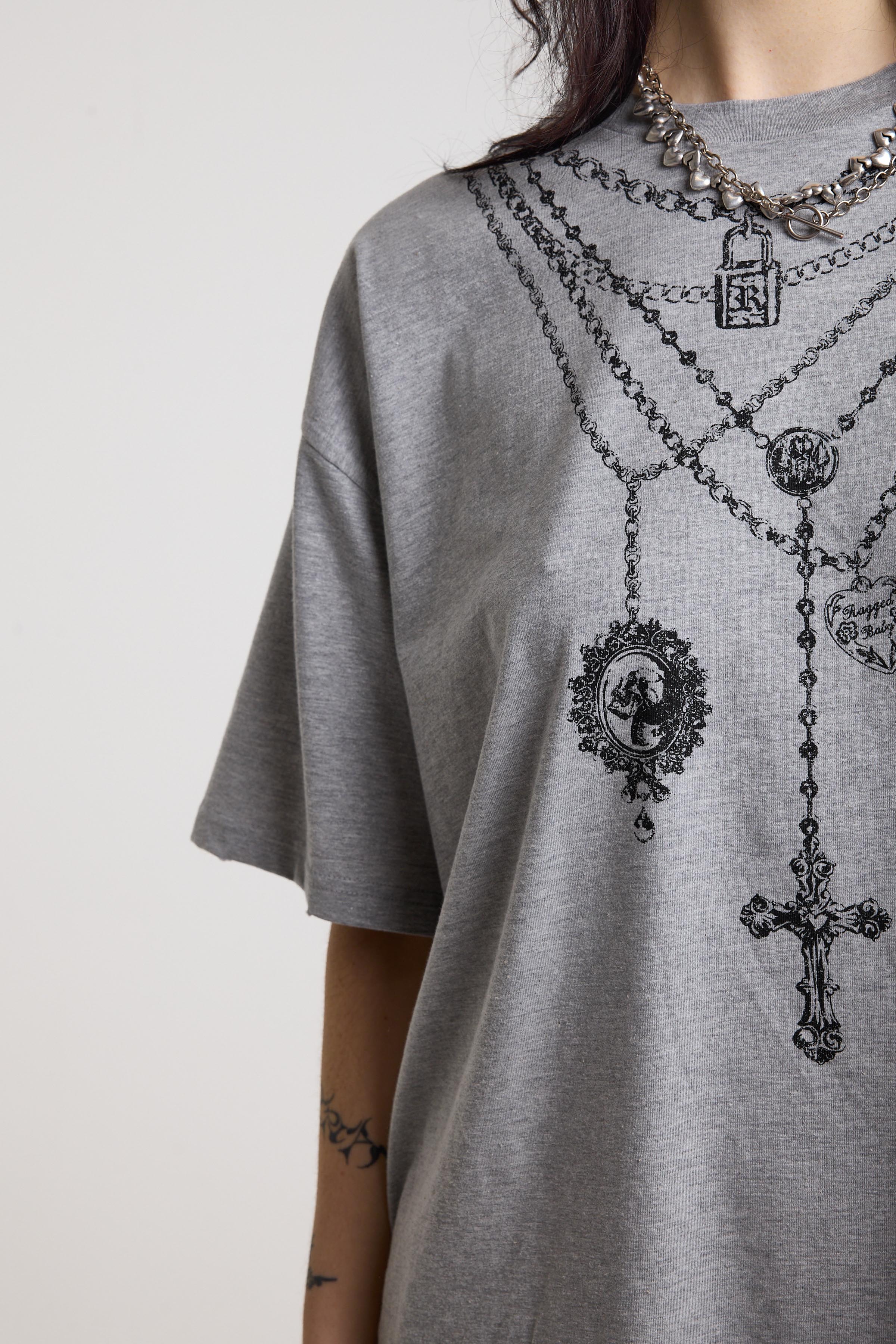 Grey marl oversized baby t-shirt with rosary pendants and cross necklace graphic, worn by a model